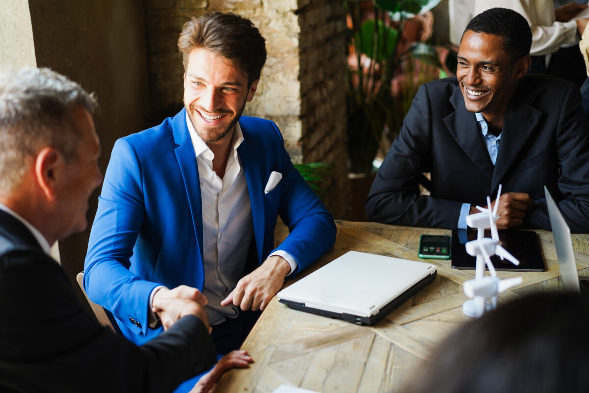 Business people working on sustainable innovation project – Green deal and environment concept – Focus on right man face Business people working on sustainable innovation project - Green deal and envinroment concept - Focus on right man face.